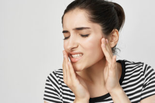 Woman with jaw pain